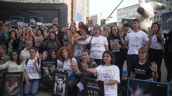 End the Cage Age stunt in front of the EU Commission building in Brussels
